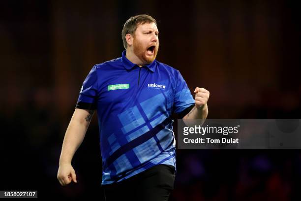 Cameron Menzies of Scotland reacts in his first round match against Rusty-Jake Rodriguez of Austria on Day One of 2023/24 Paddy Power World Darts...