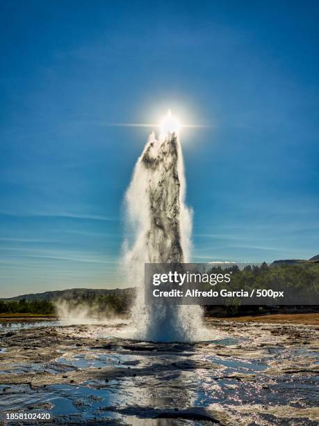 scenic view of sea against sky - geysir stock-fotos und bilder