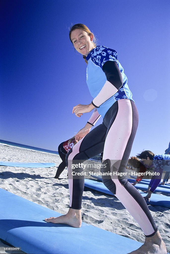 Woman learning how to surf