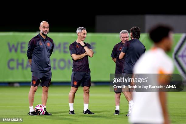 Pep Guardiola the head coach / manager of Manchester City alongside assistant managers Carlos Vicens and Juanma Lillo during the MD-1 training...