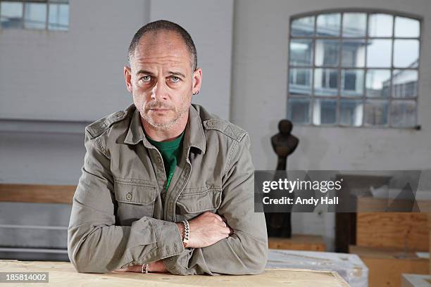 Artist Dinos Chapman is photographed for the Observer on May 15, 2013 in London, England.