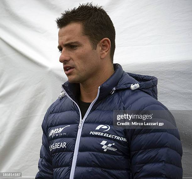 Randy De Puniet of France and Suzuki Test Team speaks in paddock during the MotoGP Of Japan - Free Practice at Twin Ring Motegi on October 25, 2013...