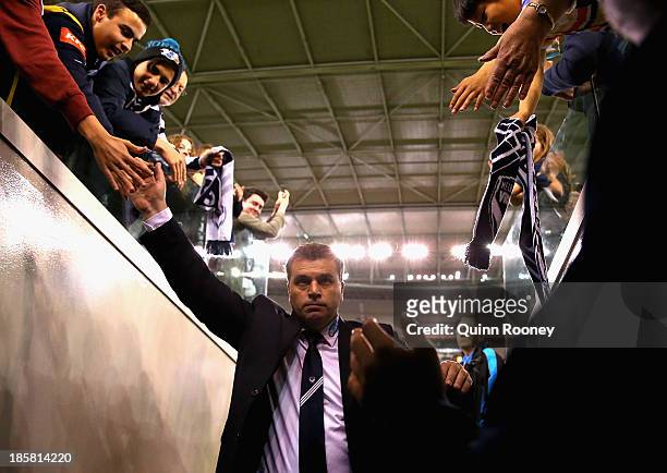 Ange Postecoglou the coach of the Victory waves good bye to the crowd during the round three A-League match between Melbourne Victory and Brisbane...