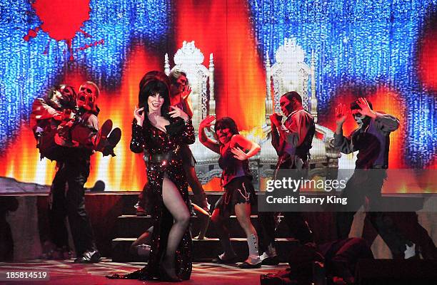 Entertainer Elvira performs in her 'Elvira's Sinema Seance' show at Knott's Scary Farm Halloween Haunt on October 24, 2013 in Buena Park, California.