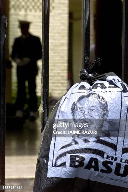 Sweeping bag with the image of Peruvian President Alberto Fujimori is hung in the gate of Joint Command of the Peruvian armed forces in Lima, Peru,...