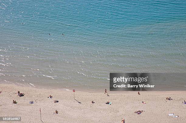 people on white sand beach near clear waters - tel aviv stock-fotos und bilder