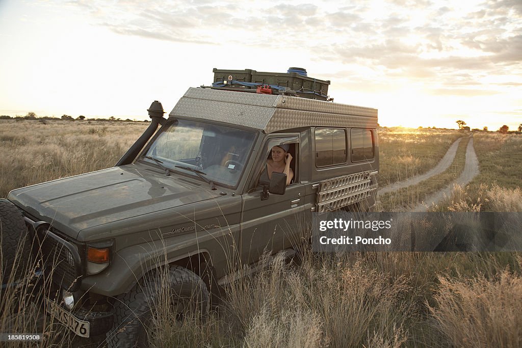 Woman looking out of a Landcruiser