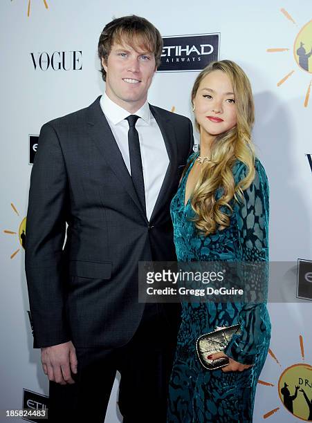 Actress Devon Aoki and James Bailey arrive at the Dream For Future Africa Foundation Gala at Spago on October 24, 2013 in Beverly Hills, California.