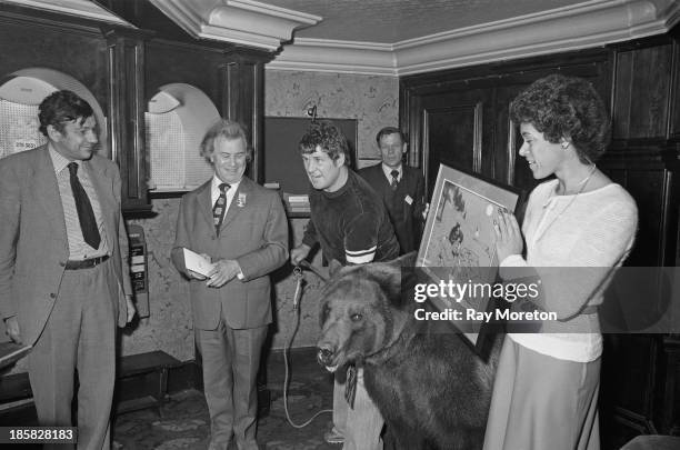 Wrestler Andy Robin with his grizzly bear, Hercules , at an award ceremony held by the Cartoonists' Club of Great Britain, London, 14th November...