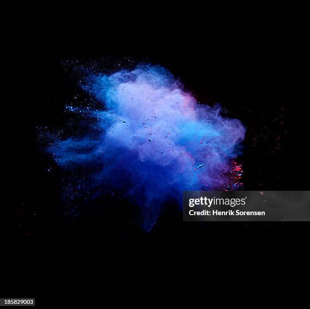explosion of colored powder - coloured smoke stock-fotos und bilder