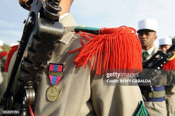 French soldiers of the 4th regiment of the Foreign Legion stand on October 25, 2013 at the Bel Air farm near the southwestern French town of...