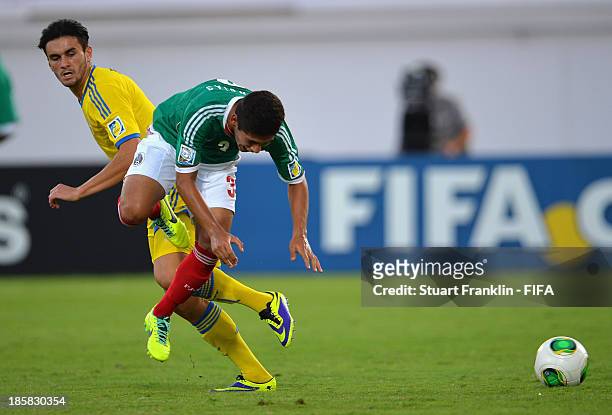 Valmir Berisha of Sweden is challenged by Salomon Wbias of Mexico during the FIFA U 17 World Cup group F match between Sweden and Mexico at Khalifa...