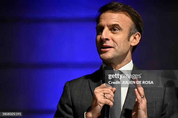 France's President Emmanuel Macron delivers a speech during a ceremony before France's handball team players at the presidential Elysee Palace in...