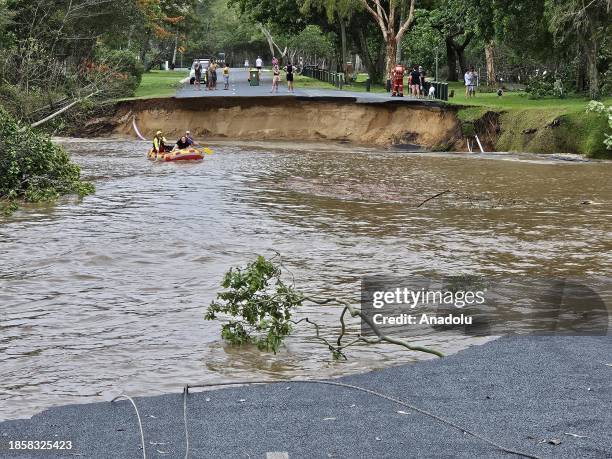 Personnel conduct search and rescue operations in the flooded area in Queensland, Australia on December 18, 2023. More than 300 rescued from...