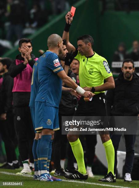 Referee Nuno Almeida gives a red card to Pepe of Porto during the Liga Portugal Bwin match between Sporting CP and FC Porto at Estadio Jose Alvalade...