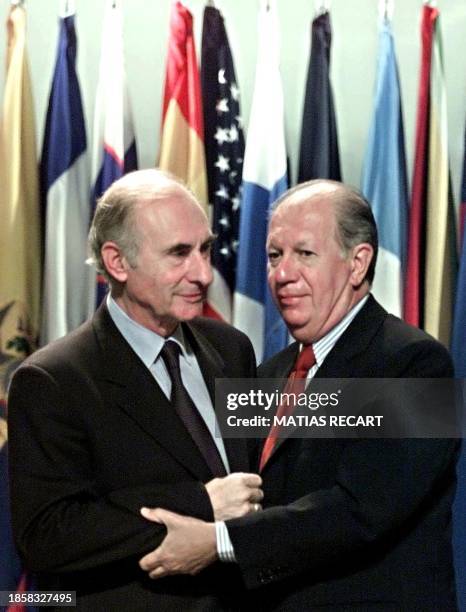 Argentine President Fernando De la Rua is greeted by his Chilean counterpart Ricardo Lagos during the inauguration of the 42nd annual meeting of the...