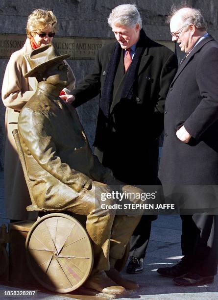 President Bill Clinton along with former US President Franklin Delano Roosevelt's granddaughter Ann Roosevelt and his grandson James Roosevelt tour...