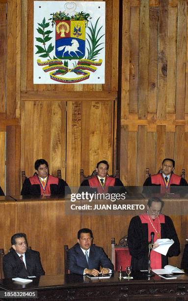 Venezuelan President Hugo Chavez listens with Comptroller of the Republic Isaias Rodriguez , to the president of the Supreme Court Ivan Ricon during...