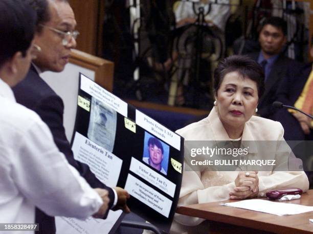 Prosecution witness, Eleanor Madrid , department head of the government Land Transportation Office, identifies driver's license of Eleuterio Tan, at...