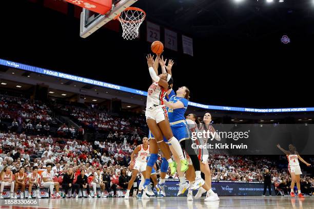 Cotie McMahon of the Ohio State Buckeyes and Lina Sontag of the UCLA Bruins compete for a rebound during the second quarter of the game at Value City...