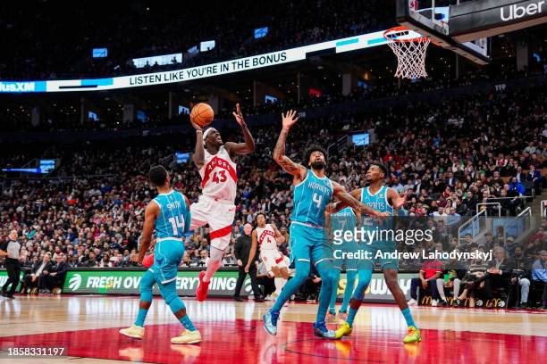Pascal Siakam of the Toronto Raptors goes to the basket against Nick Richards of the Charlotte Hornets during first half NBA action at Scotiabank...