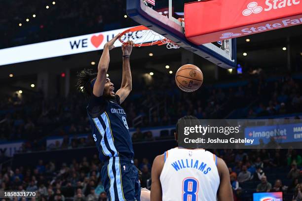 Ziaire Williams of the Memphis Grizzlies finishes a dunk during the first half against the Oklahoma City Thunder at Paycom Center on December 18,...