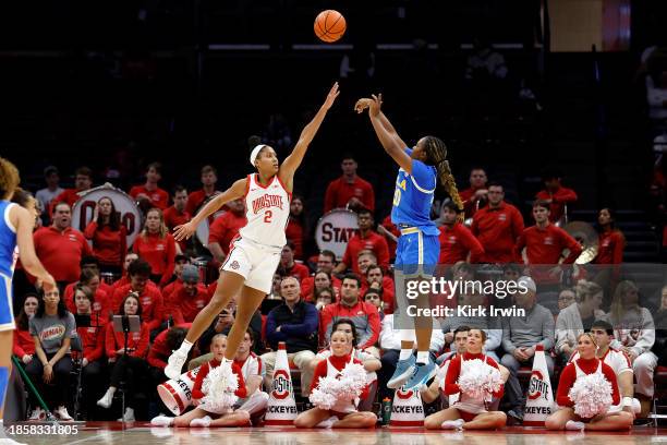 Charisma Osborne of the UCLA Bruins shoots the ball over the defense of Taylor Thierry of the Ohio State Buckeyes during the fourth quarter at Value...
