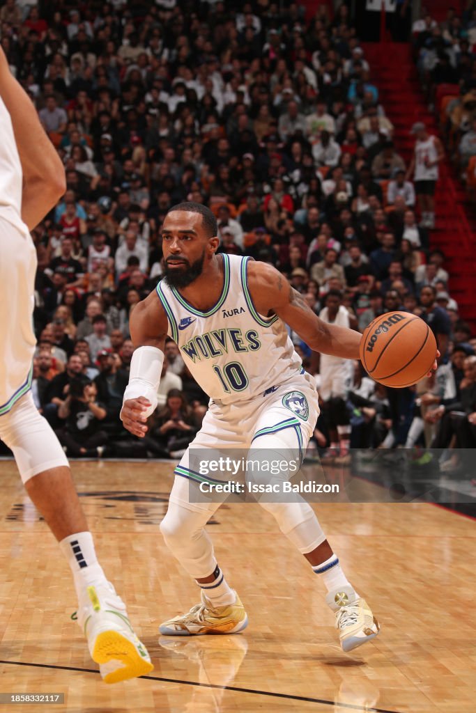 Mike Conley of the Minnesota Timberwolves handles the ball during the ...