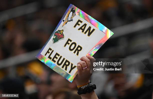 Fan holds up a sign for Marc-Andre Fleury of the Minnesota Wild in the third period during the game against the Pittsburgh Penguins at PPG PAINTS...