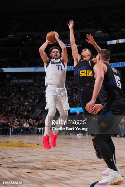 Luka Doncic of the Dallas Mavericks shoots the ball during the game against the Denver Nuggets on December 18, 2023 at the Ball Arena in Denver,...