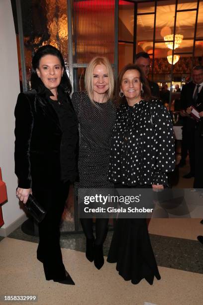 Iris Salzberg, Alexandra Holland, Karin Holler during the Greipl Christmas Charity Dinner at Reitschule on December 18, 2023 in Munich, Germany.