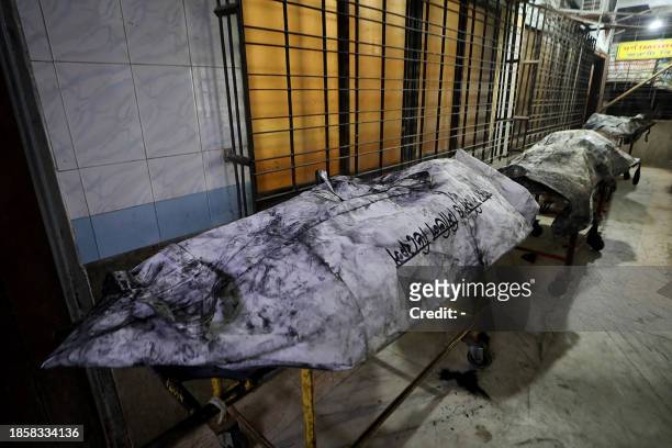 Graphic content / Victims' dead bodies are pictured at a hospital after a railway coach allegedly set on fire by opposition activists, in Dhaka on...