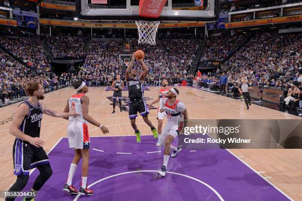 De'Aaron Fox of the Sacramento Kings drives to the basket during the game against the Washington Wizards on December 18, 2023 at Golden 1 Center in...