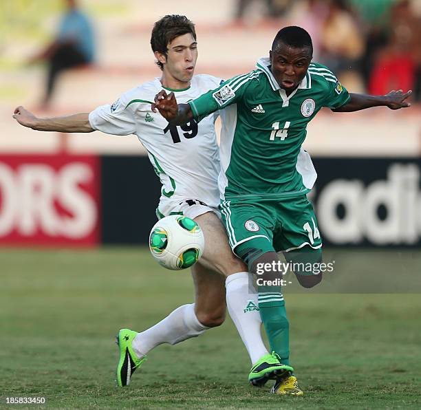 Iraq's Mustafa Mohammed vies with Nigeria's Chidiebere Nwakali during their FIFA U-17 World Cup UAE 2013 football match Iraq versus Nigeria on...