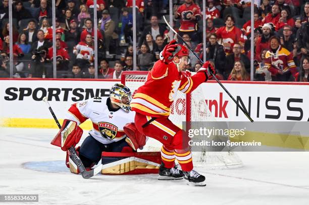 Calgary Flames Center Mikael Backlund scores a goal against Florida Panthers Goalie Anthony Stolarz during the third period of an NHL game between...