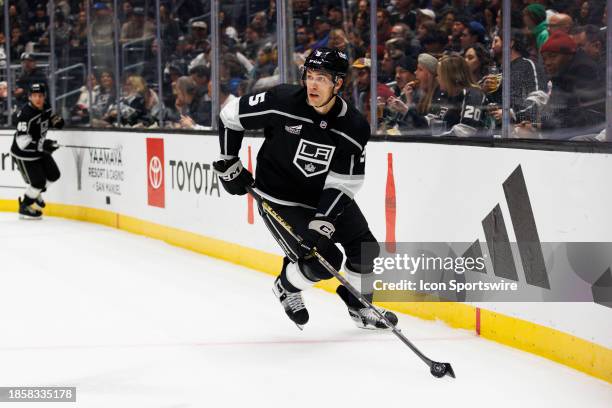 Los Angeles Kings defenseman Andreas Englund skates with the puck during an NHL hockey game against the Winnipeg Jets on December 13, 2023 at...