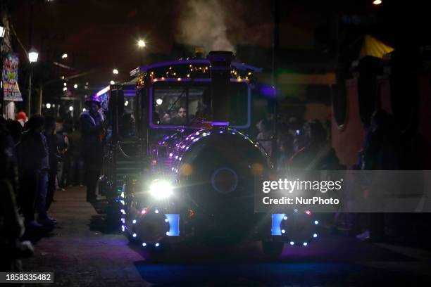 New Christmas Train is circulating through the streets of Santiago Zapotitlan Tlahuac, Mexico City, where dozens of people are boarding it as part of...