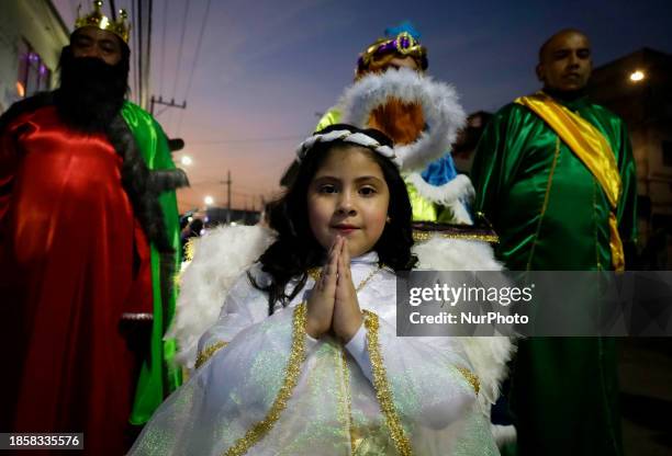 Group of people is hoping to board the new Christmas Train that is circulating in the streets of Santiago Zapotitlan Tlahuac, Mexico City, as part of...