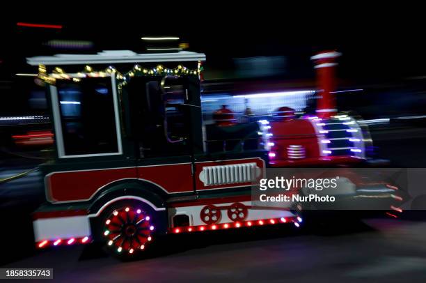 New Christmas Train is circulating through the streets of Santiago Zapotitlan Tlahuac, Mexico City, where dozens of people are boarding it as part of...