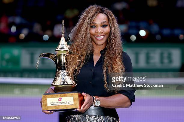 Serena Williams of the United States poses for photographers after receiving the WTA Year End No. 1 Singles presented by Dubai Duty Free trophy...