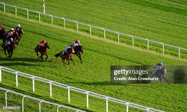 Shane Kelly riding Amulet win The CSP Handicap Stakes at Newbury racecourse on October 25, 2013 in Newbury, England.