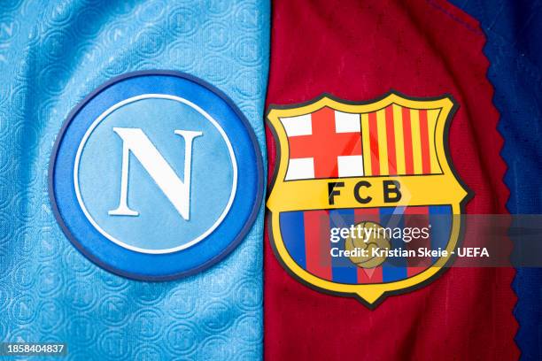 Detailed view of the badges of SSC Napoli and FC Barcelona during a photo shoot after the UEFA Champions League 2023/24 Round of 16 Draw at the UEFA...