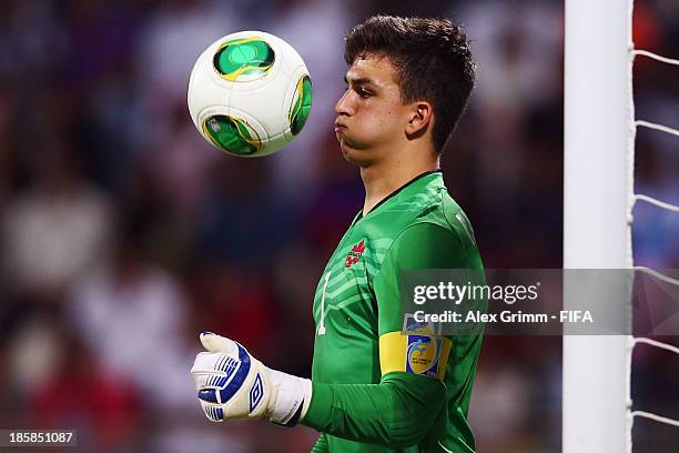 Goalkeeper Marco Carducci of Canada controles the ball during the FIFA U-17 World Cup UAE 2013 Group E match between Argentina and Canada at Al...