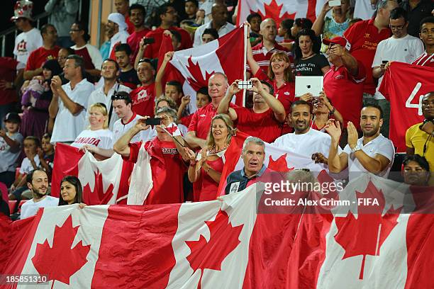 Fans of Canada cheer prior to the FIFA U-17 World Cup UAE 2013 Group E match between Argentina and Canada at Al Rashid Stadium on October 25, 2013 in...