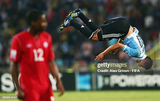 Joaquin Ibanez of Argentina celebrates his team's first goal as Kevon Black of Canada reacts during the FIFA U-17 World Cup UAE 2013 Group E match...