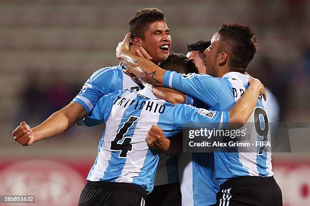 Joaquin Ibanez of Argentina celebrates his team's first goal with team mates Nicolas Tripichio and Sebastian Driussi during the FIFA U-17 World Cup...