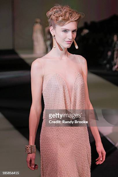Model walks the runway during the Armani - One Night Only New York at SuperPier on October 24, 2013 in New York City.