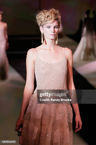Model walks the runway during the Armani - One Night Only New York at SuperPier on October 24, 2013 in New York City.