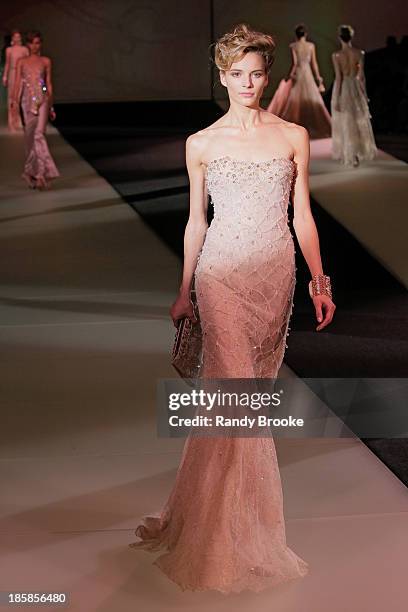 Model walks the runway during the Armani - One Night Only New York at SuperPier on October 24, 2013 in New York City.