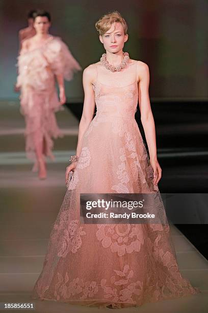 Model walks the runway during the Armani - One Night Only New York at SuperPier on October 24, 2013 in New York City.